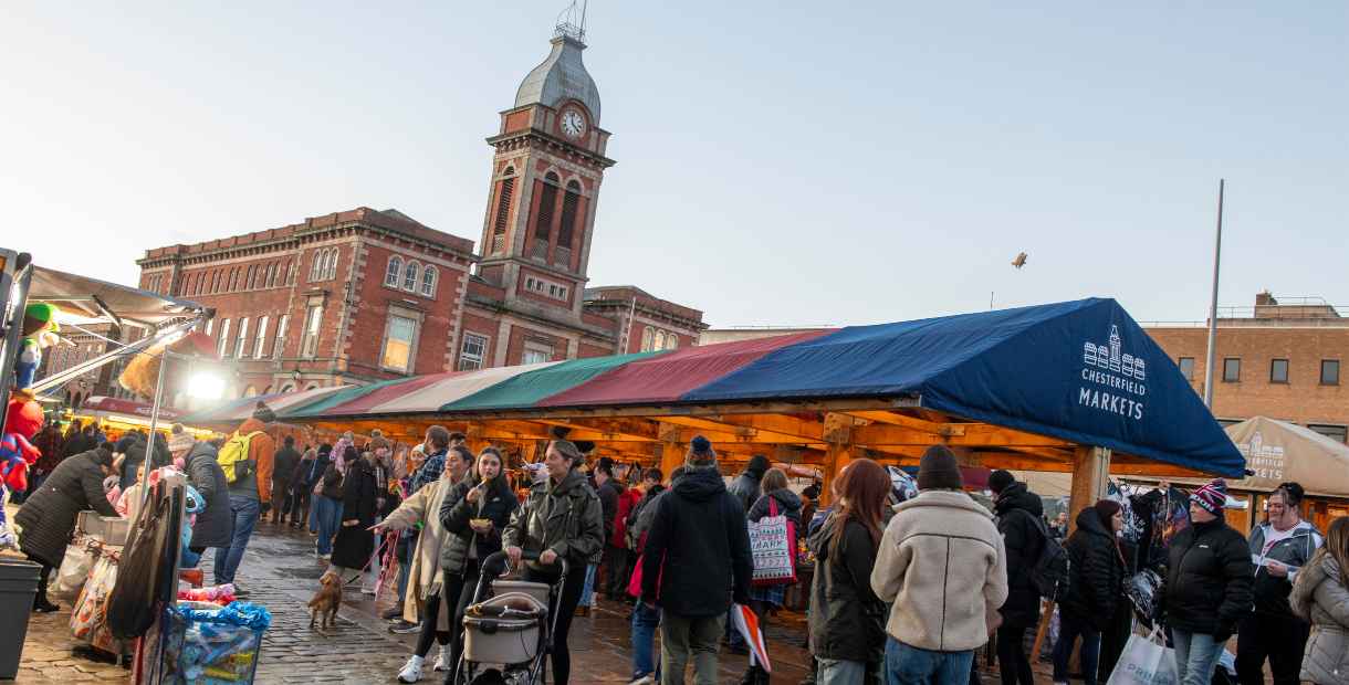 Image of Chesterfield Market with shoppers and festive stalls